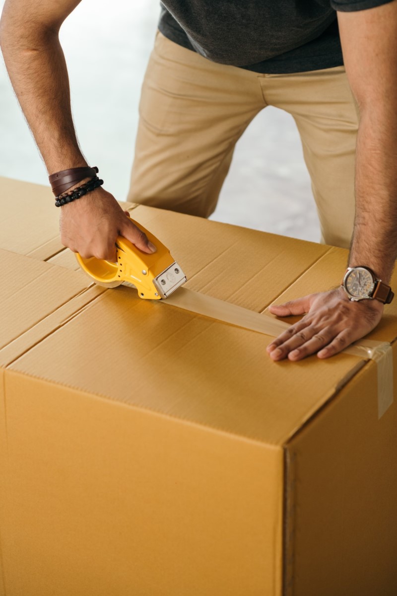man packing, 7 Money saving tips when moving to Portland OR, Real Agent Now